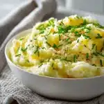 Creamy garlic mashed potatoes topped with fresh parsley