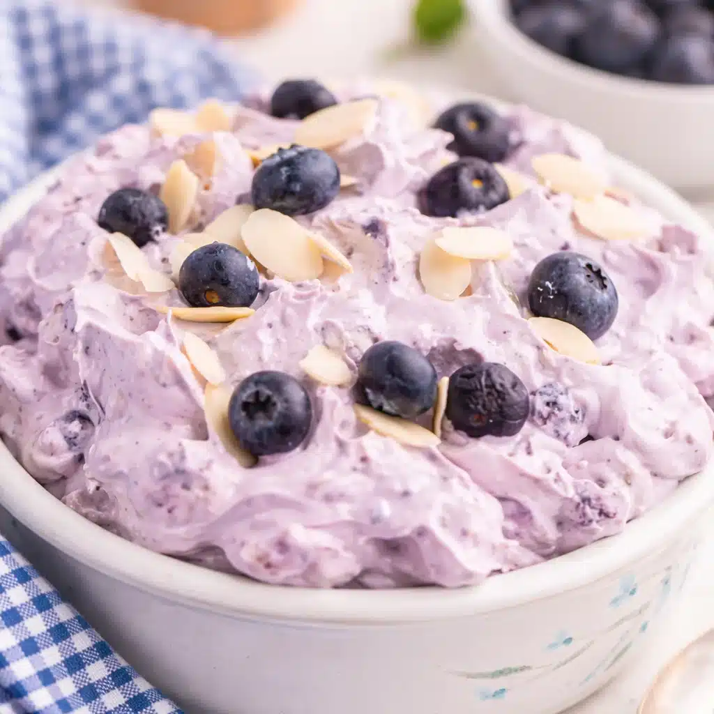 Delicious Blueberry Fluff dessert salad with whipped topping and fresh blueberries