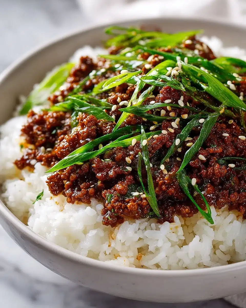 Delicious Korean Ground Beef Bowls topped with fresh vegetables and sesame seeds