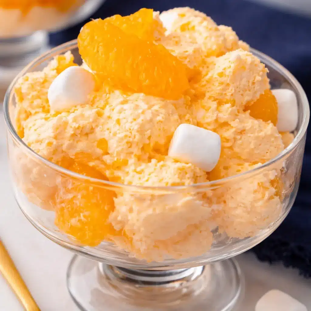 Delicious Orange Creamsicle Salad with mandarin oranges, mini marshmallows, and vanilla pudding.