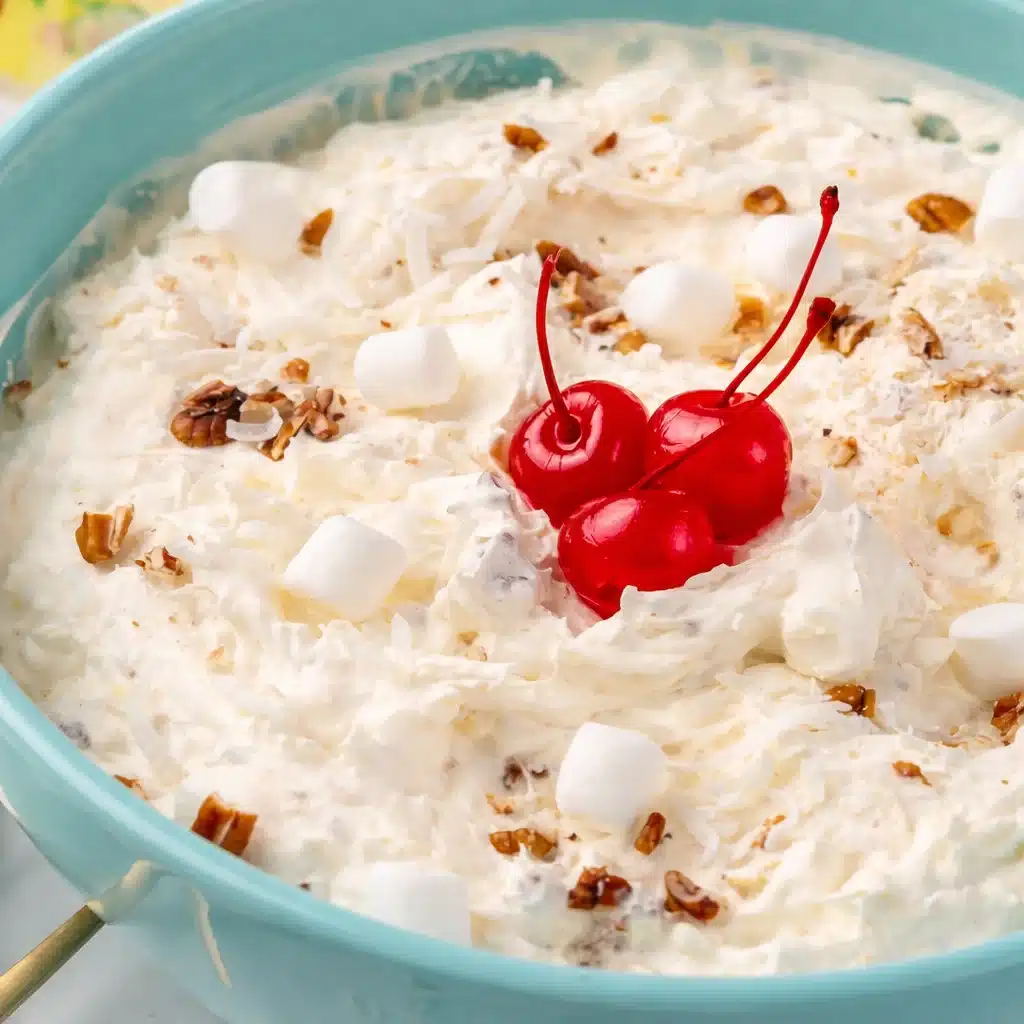 Delicious Pina Colada Fluff dessert salad with pineapple, coconut, and marshmallows.