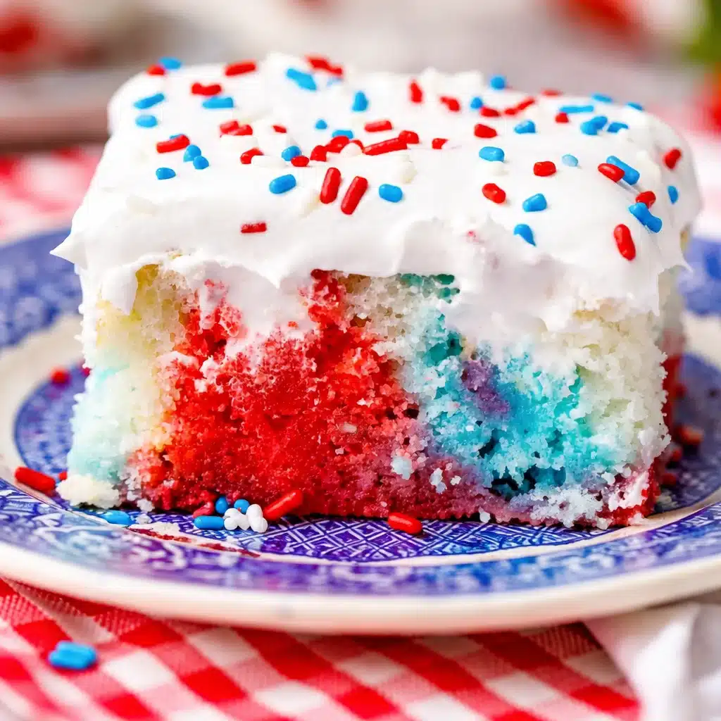 Moist Red White and Blue Poke Cake topped with whipped cream and berries for 4th of July.