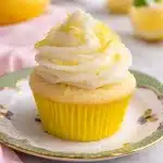 Moist Lemon Cupcakes with Cream Cheese Frosting on a plate.