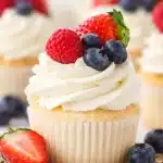 Fluffy Angel Food Cupcakes topped with whipped cream, perfect for summer desserts.