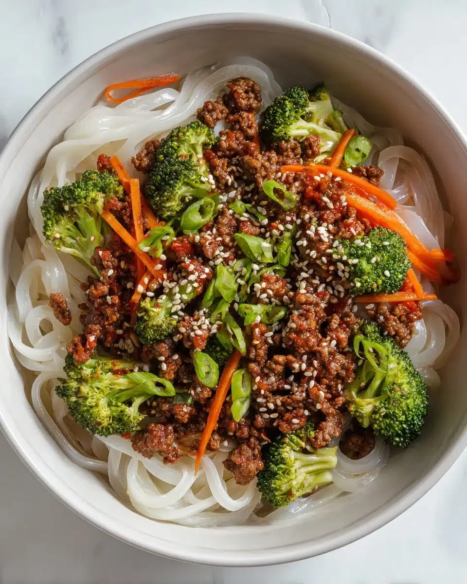 Bowl of Gochujang Beef Noodle Bowls with beef and noodles in spicy sauce
