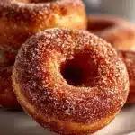 Deliciously baked apple cider donuts topped with cinnamon sugar