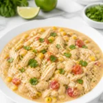 Delicious bowl of slow cooker creamy white chicken chili topped with cilantro.