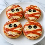 spooky mummy face english muffin halloween pizza 2026 07 17 043925 683x1024 1