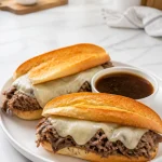 Delicious Slow Cooker French Dip Sandwich with beef and au jus